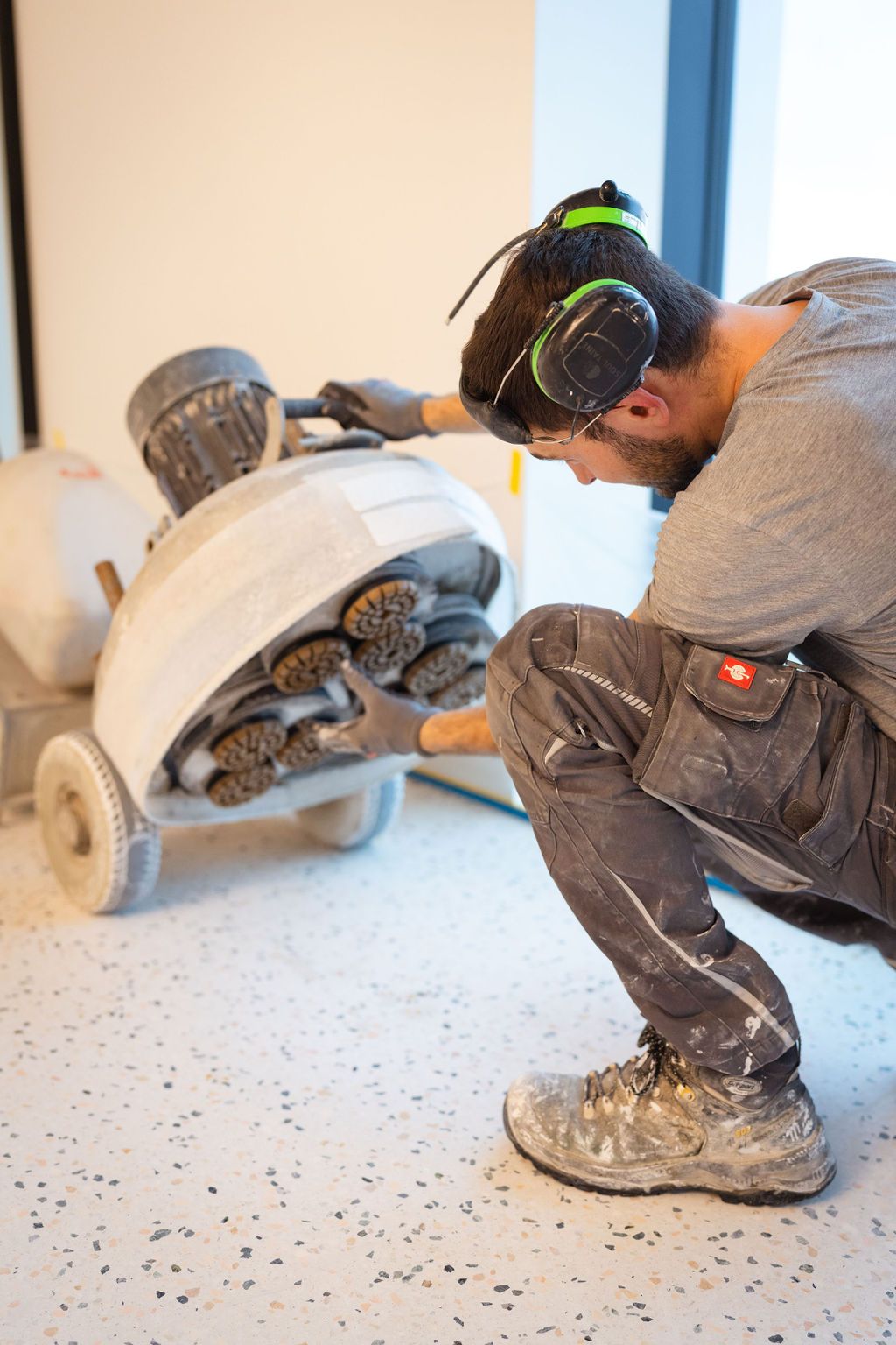 Technician working with professional concrete equipment